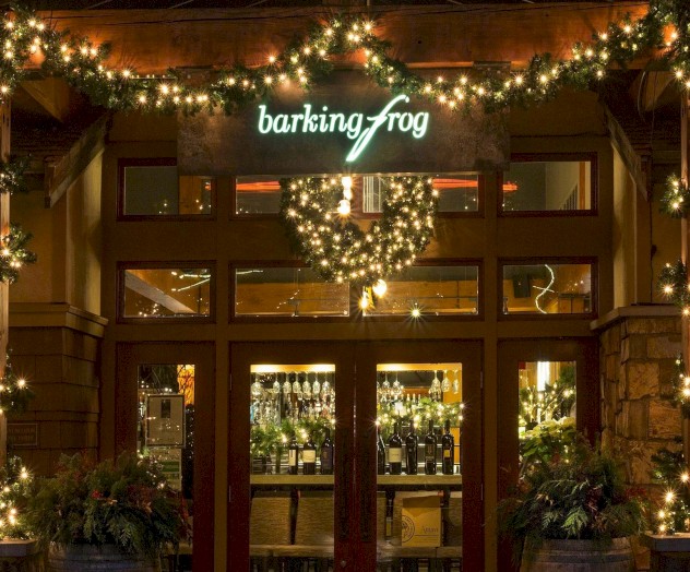 Outside of Barking Frog restaurant with holiday lights and pine boughs gracing front entrance.