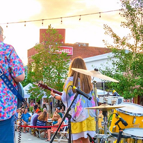 Summer Nights in Bothell showcasing a band playing al fresco at sunset