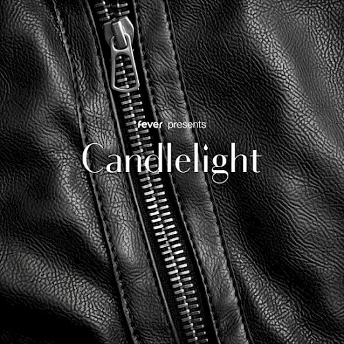 The image shows a close-up of a black leather jacket's zipper with the text 